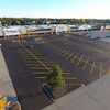 Initially the job was a mill and fill project. Asphalt Contractors had intended to just do a small patch but the inspector read the plans and determined the entire parking lot had to be milled, paved and striped before the stores could open.