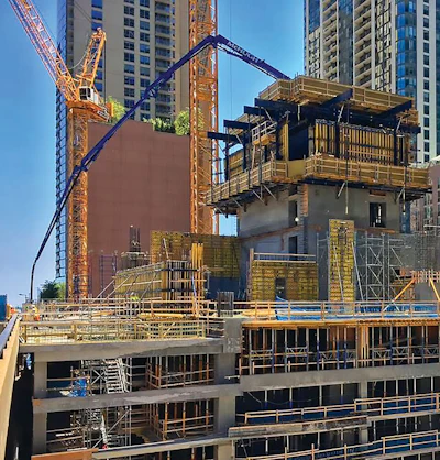 Putzmeister concrete pumping equipment stands tall as the Vista Tower ascends in downtown Chicago.