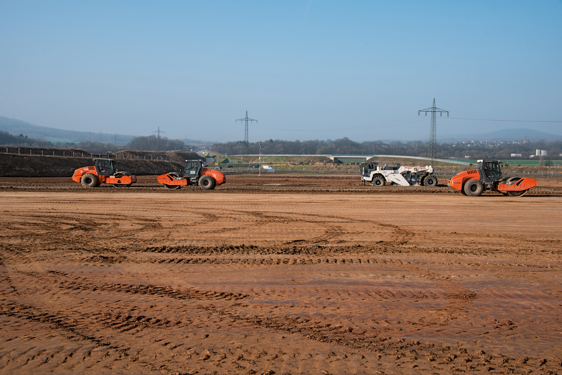 Soil compaction was completed by Hamm compactors with padfood drums. Compactors with smooth drums then saw to the final compaction.