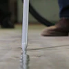 Today's joint fillers are intentionally over-applied in warehouse and industrial applications, and flush-trimmed with a floor razor to keep out debris and protect slab edges from spalling.