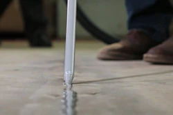 Today's joint fillers are intentionally over-applied in warehouse and industrial applications, and flush-trimmed with a floor razor to keep out debris and protect slab edges from spalling.