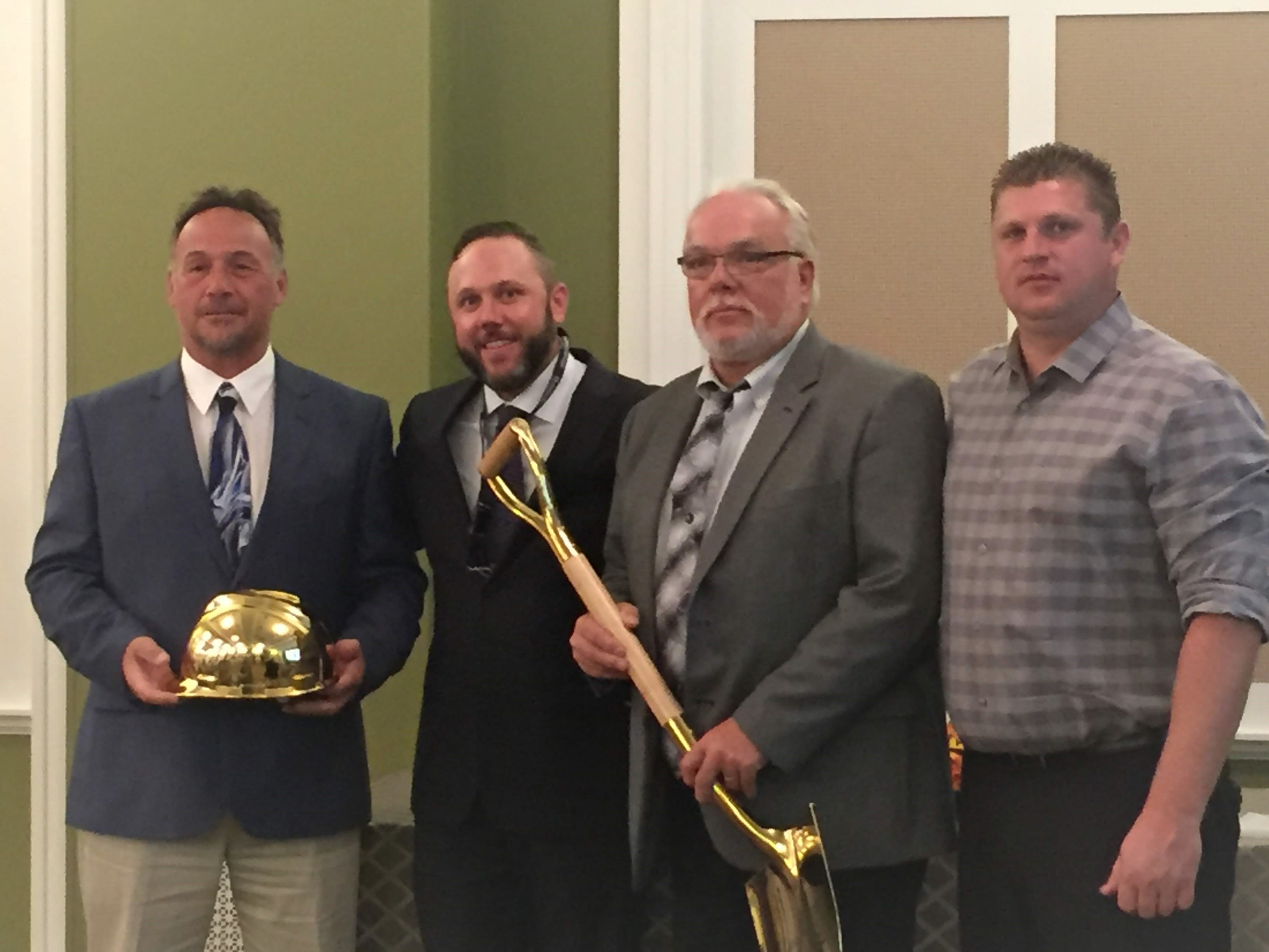 At the NUCA PA award ceremondy (from left) Steve Funk, General Superintendent, Schlouch Inc.; Chuck Fehlinger, NUCA PA President; Don Swasing, Chief Operating Officer, Schlouch Inc.; and William Kukurin, NUCA PA Vice-President.