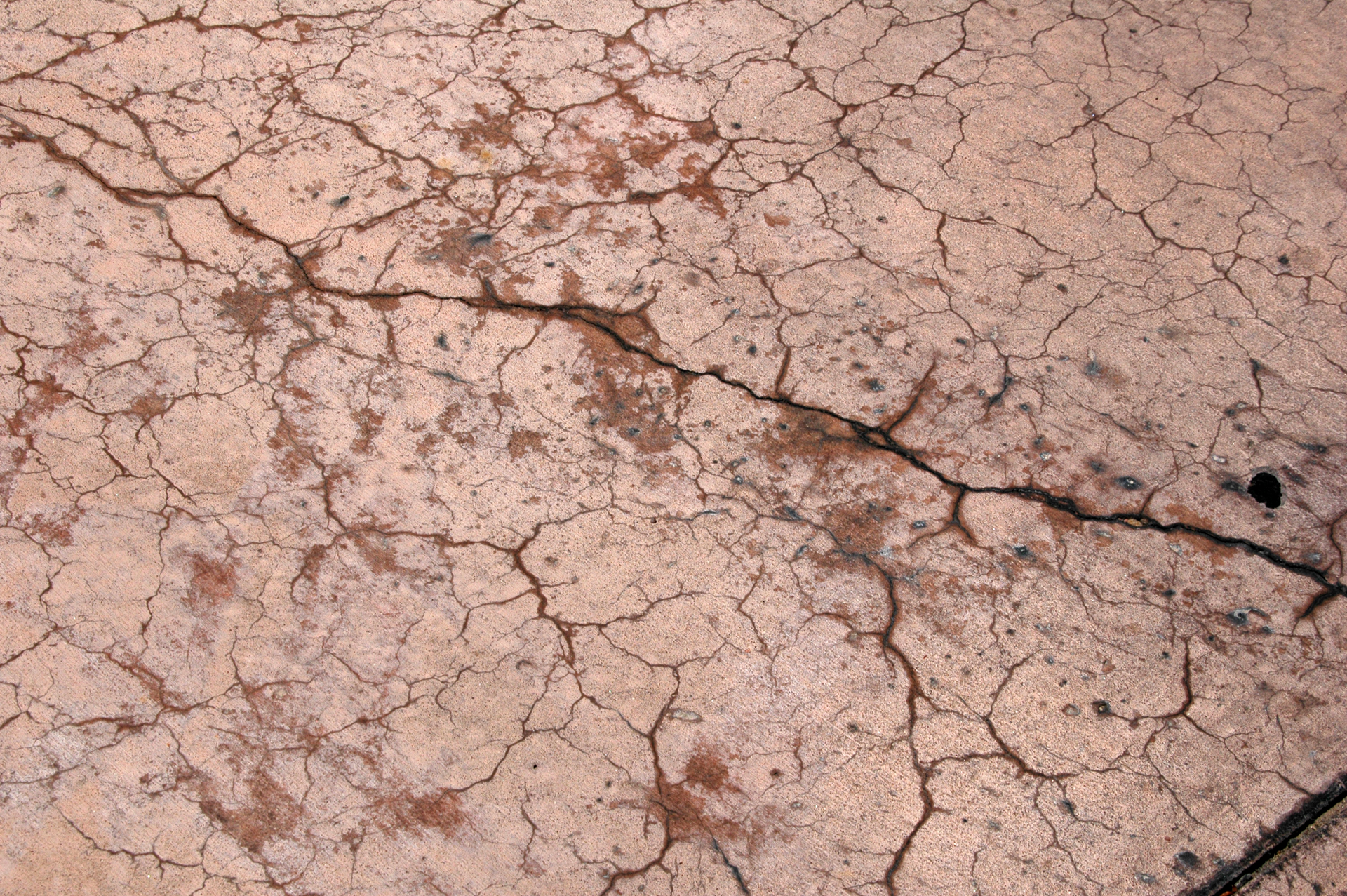 Surface cracking happens while the concrete is still fresh and before it undergoes initial set. Weather conditions not favorable to concrete are the primary cause. The best protection for contractors is to collect on-site ambient weather data and concrete temperatures and use the nomograph to predict whether cracking will occur.
