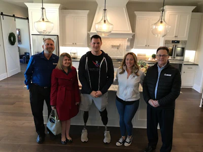 In the kitchen of the Murphys’ new smart home (pictured left to right): MAPEI Business Development Leader Dale Penland, MAPEI Marketing Communications Manager Jennifer Kramer, United States Army Captain (Ret.) Jake Murphy, Jake’s wife Lisa Murphy and MAPEI Central Area Sales Director Kyle Murphy