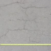 Occurring in both random and parallel patterns, plastic shrinkage cracks are discontinuous, relatively short and typically fairly shallow. Occasionally they can become full-depth cracks. Parallel cracks are typically spaced between a few inches to several feet apart and many times are oriented perpendicular to the prevailing wind direction. Cracks widths at the surface can be fairly wide (as much as 1/8 in.) but rapidly diminish with depth.