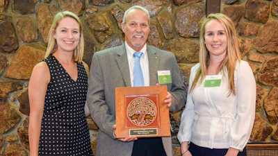 Jim Whitfield, MAPEI Corporation’s Director of Technical Services, and Brittany Storm, MAPEI Corporation’s Sustainabaility Manager, receiving the award.
