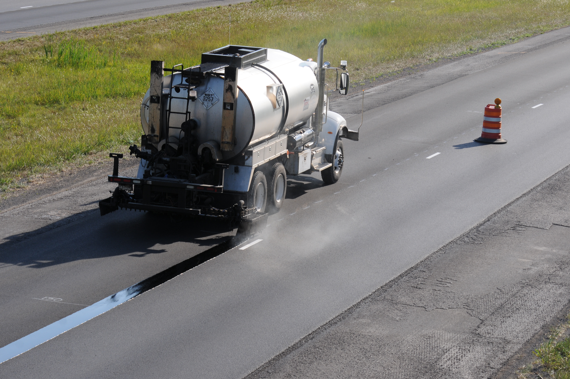 What’s unique about a void-reducing asphalt membrane is that it is applied beneath the asphalt mat before the mat is placed. It is sprayed beneath where the longitudinal joint will be.