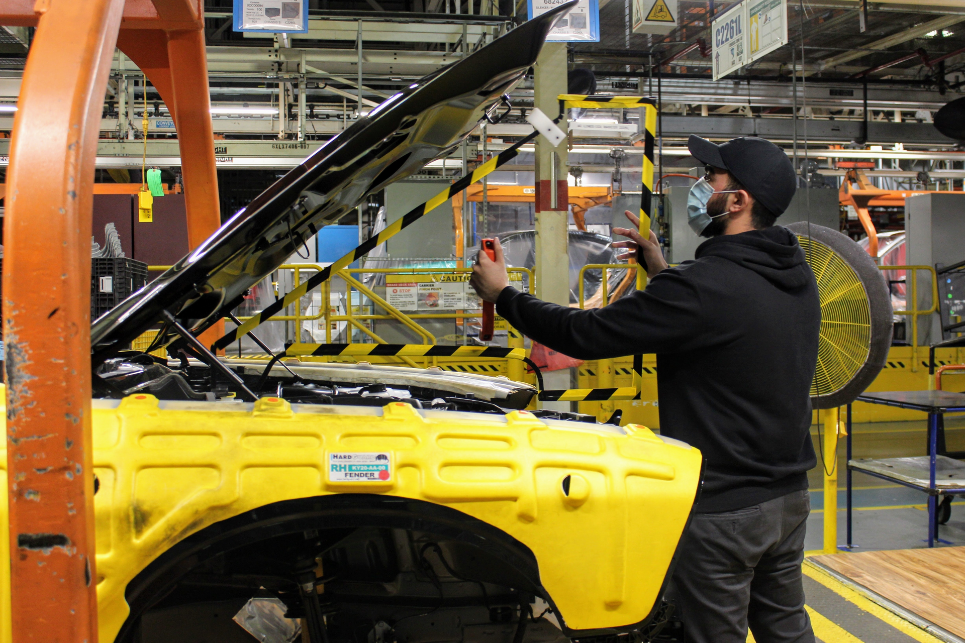 An operator at FCA’s Brampton Ontario Assembly Plant installs a removable plexiglas partition in the engine compartment of a Dodge Challenger to maintain proper distancing between the employees working in the area. The barrier is installed to protect employees from the spread and transmission of COVID-19. With protecting the health and safety of its employees a top priority, the Company is implementing robust protocols that will ensure all facilities are safe, secure and disinfected when production resumes.