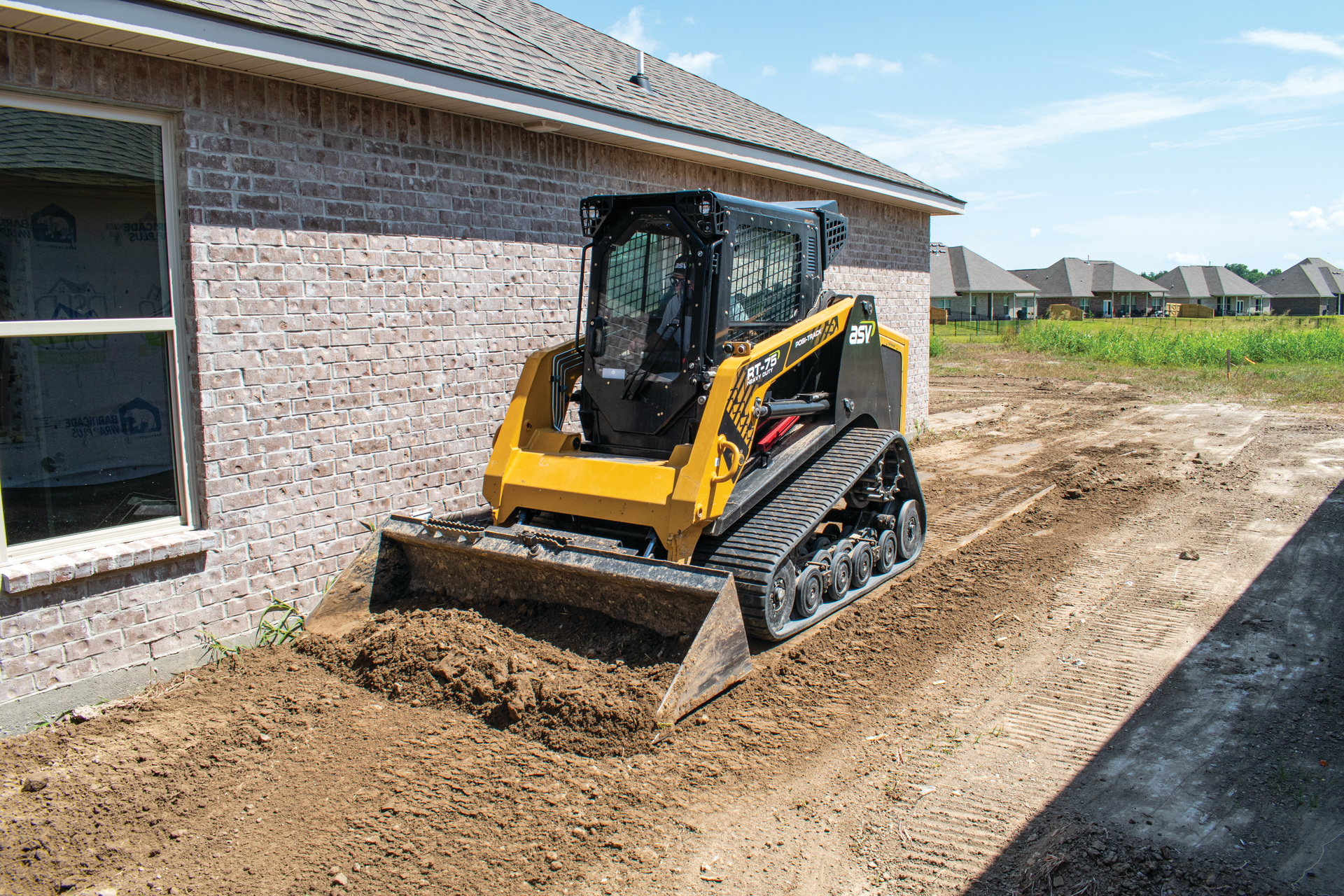 Lloyd Landry can get back to work quickly following a rainfall, thanks to the tracked machine.