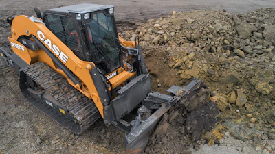 Case's new DL550B dozer/loader distinguishes itself from compact track loaders with a frame-mounted dozer, steel tracks and structural weight designed for heavy dozing work.