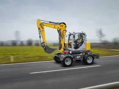 The ability of the machine to travel from site to site quickly allows the excavator to efficiently support ground crews that a slower tracked machine just can’t, and with no need to worry about track scuffs on sensitive or decorative paved surfaces.