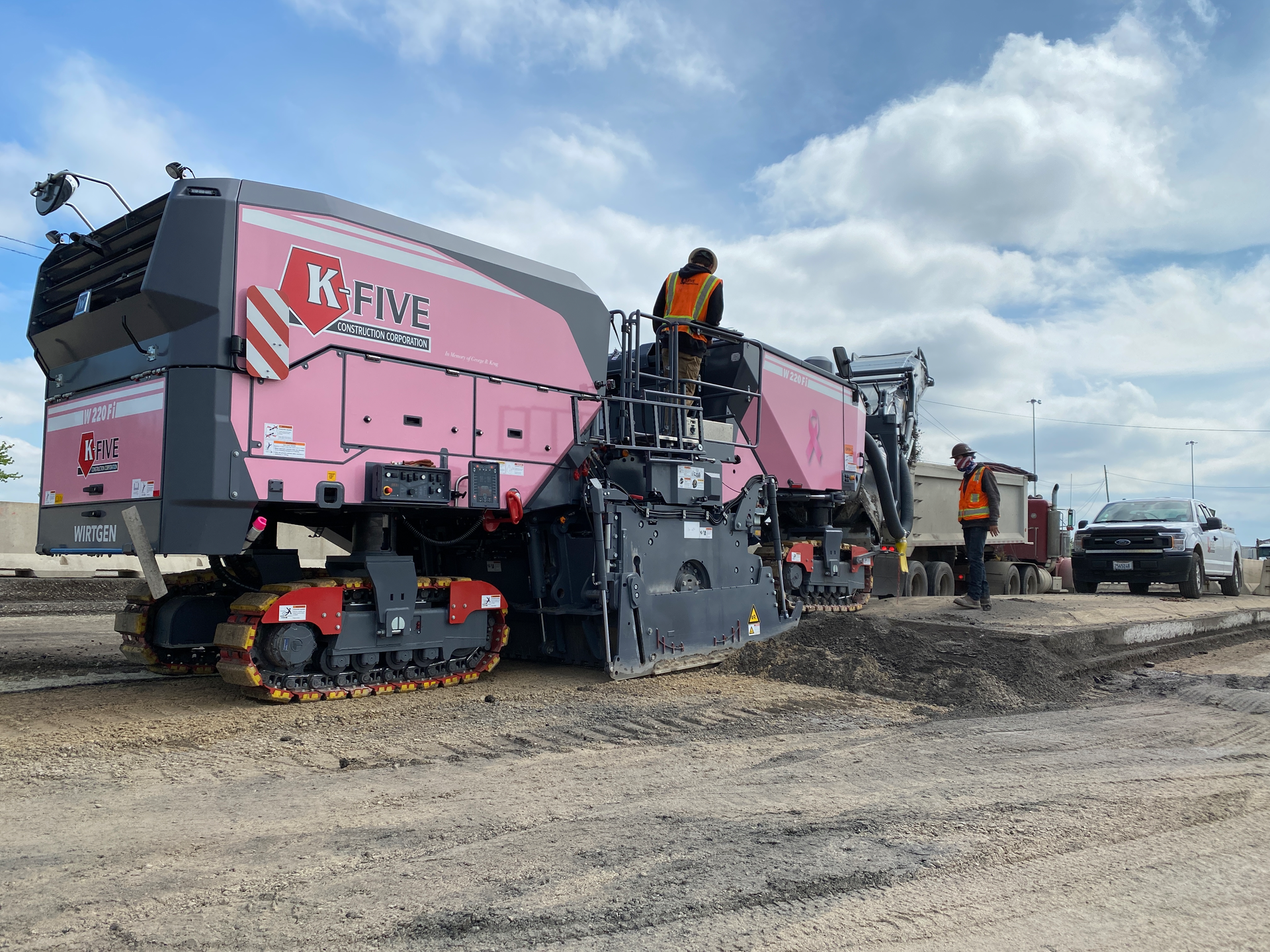 The new F-Series Wirtgen mills include the option to add a customizable wrap around the machine. While most companies utilize this to add a logo or company colors, K-Five Construction’s shop manager, Dave Gorski, came to them with the idea for a pink wrap as a way to promote cancer awareness.