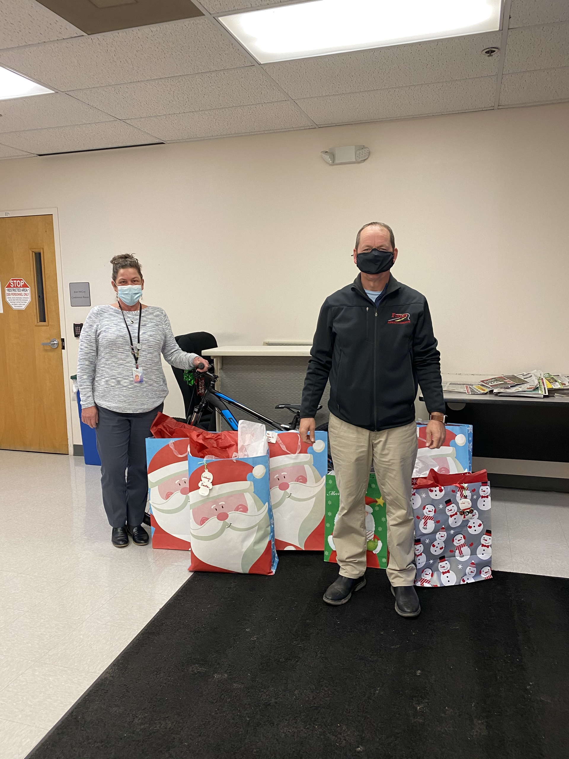 Erick Finley, owner of Finley Asphalt & Concrete donates presents to Prince William County Department of Social Services. These gifts benefit children who are in their foster care program.