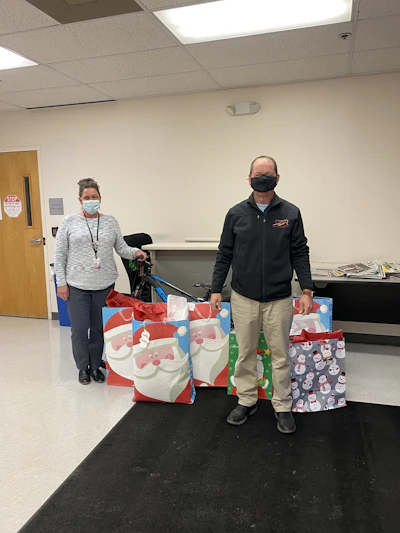 Erick Finley, owner of Finley Asphalt & Concrete donates presents to Prince William County Department of Social Services. These gifts benefit children who are in their foster care program.