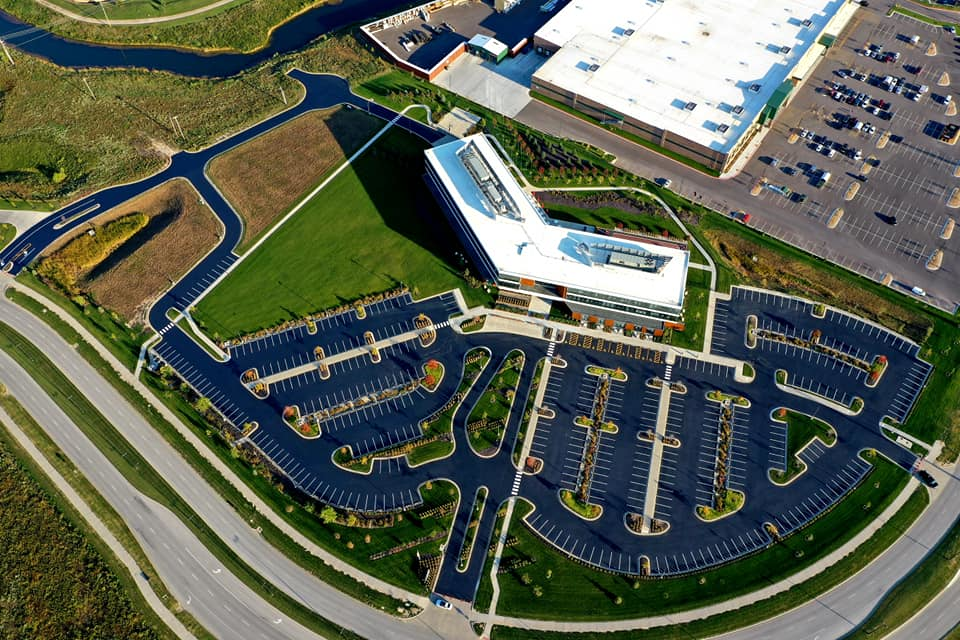 The job required cleaning, crack sealing, applying two coats of asphalt and striping a 200,000 sq-ft parking lot, all while keeping the client, Kansas City-based Dairy Farmers of America, operational.