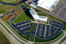 The job required cleaning, crack sealing, applying two coats of asphalt and striping a 200,000 sq-ft parking lot, all while keeping the client, Kansas City-based Dairy Farmers of America, operational.