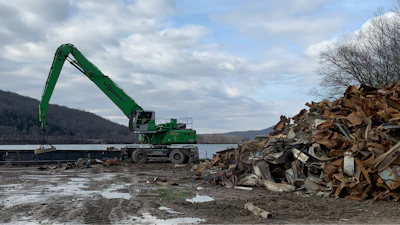 A Sennebogen 840 M was used on a power plant project in Ohio, where barge loading operations required a heavier machine with longer reach.