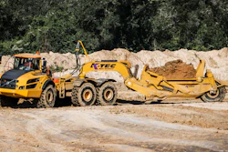 Summit utilized two Volvo 40-ton articulated dump trucks pulling K-Tec 1237ADT scrapers (such as shown) in a train configuration on the long haul from the east spoil pile.