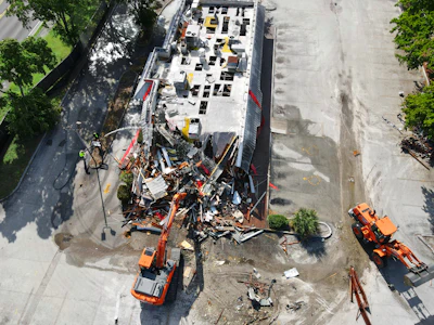 A Doosan DX225LC-5 crawler excavator and a DL220-5 wheel loader were used to quickly complete demolition of the fast-food restaurant.
