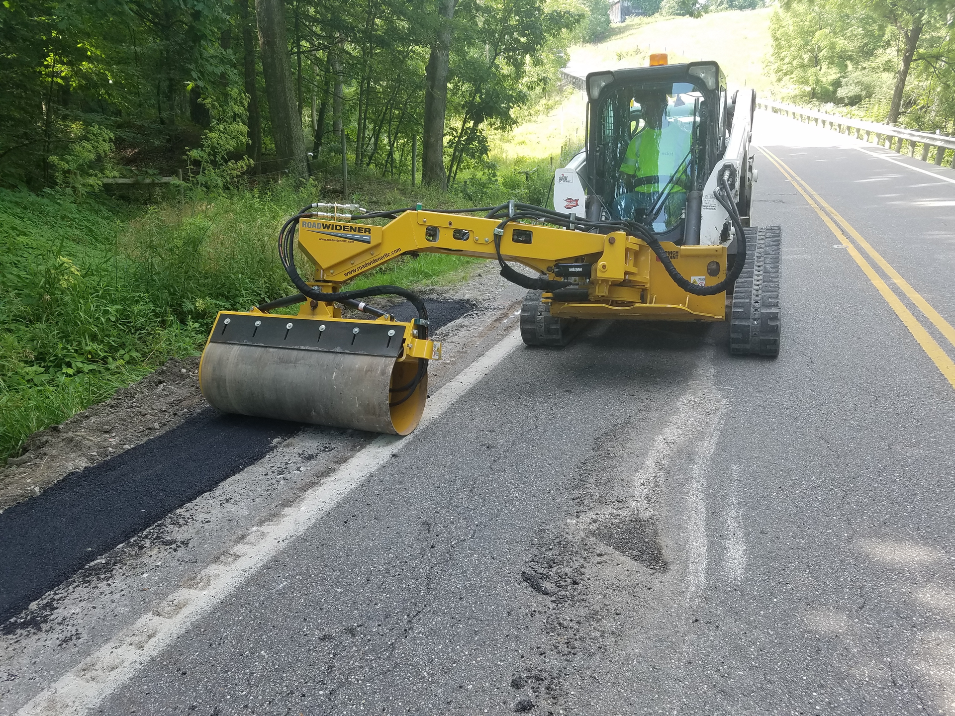 Relocating the compaction drum to an offset arm attachment maximizes safety. An operator can now drive the host machine on flat ground while the arm extends to the furthest, steepest edge of sloping road shoulders and ditches, while still being able to compact flat surfaces, too.