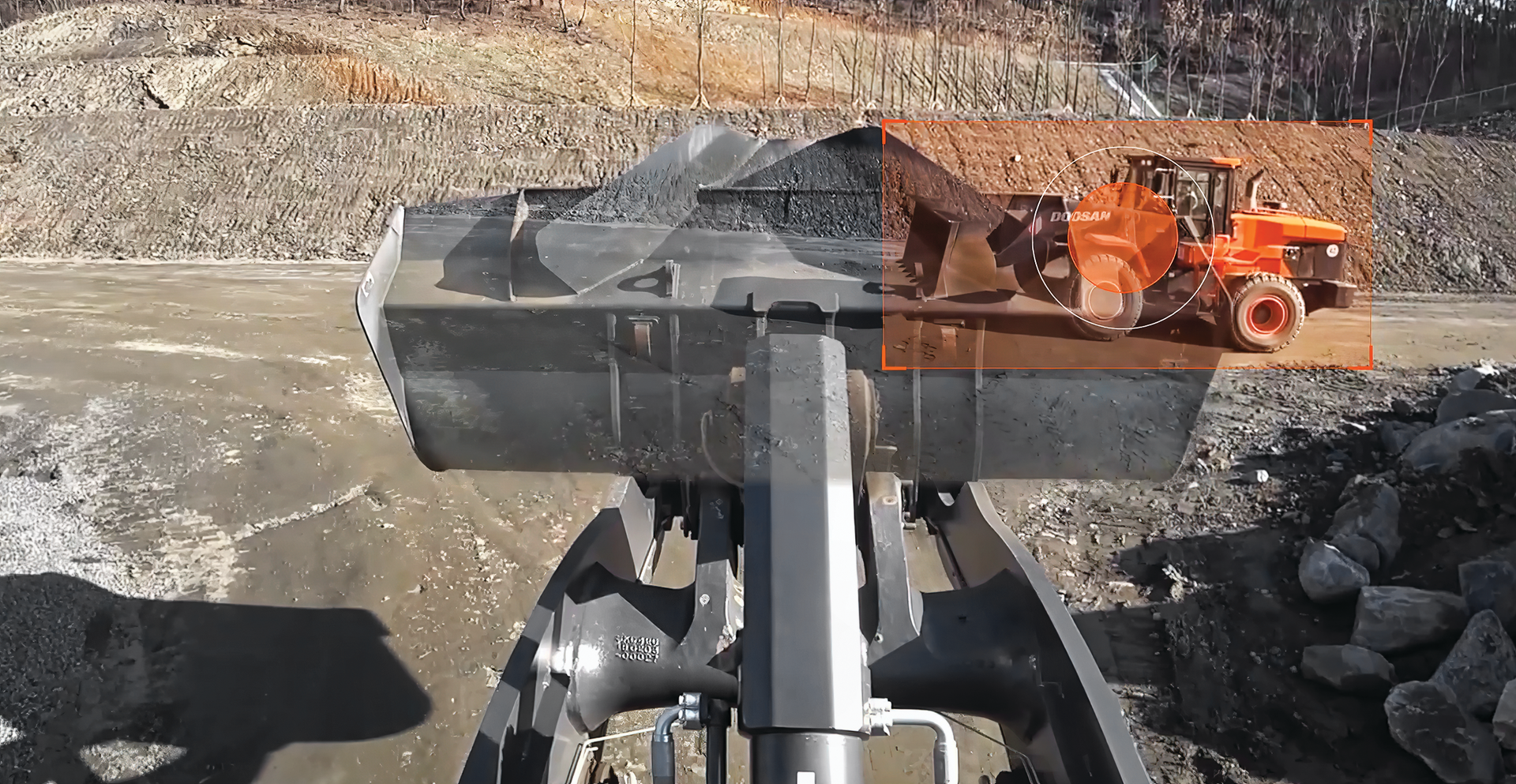 Doosan recently introduced a transparent bucket option for all the Dash-7 Series machines. The transparent bucket technology uses multiple cameras on the machine to give you a stitched overlay of those camera views to make that bucket virtually invisible.