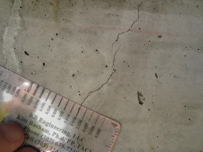 A crack compactor card can help you determine the width of the crack in question. Place the card on the crack and align the line that matches the crack width.
