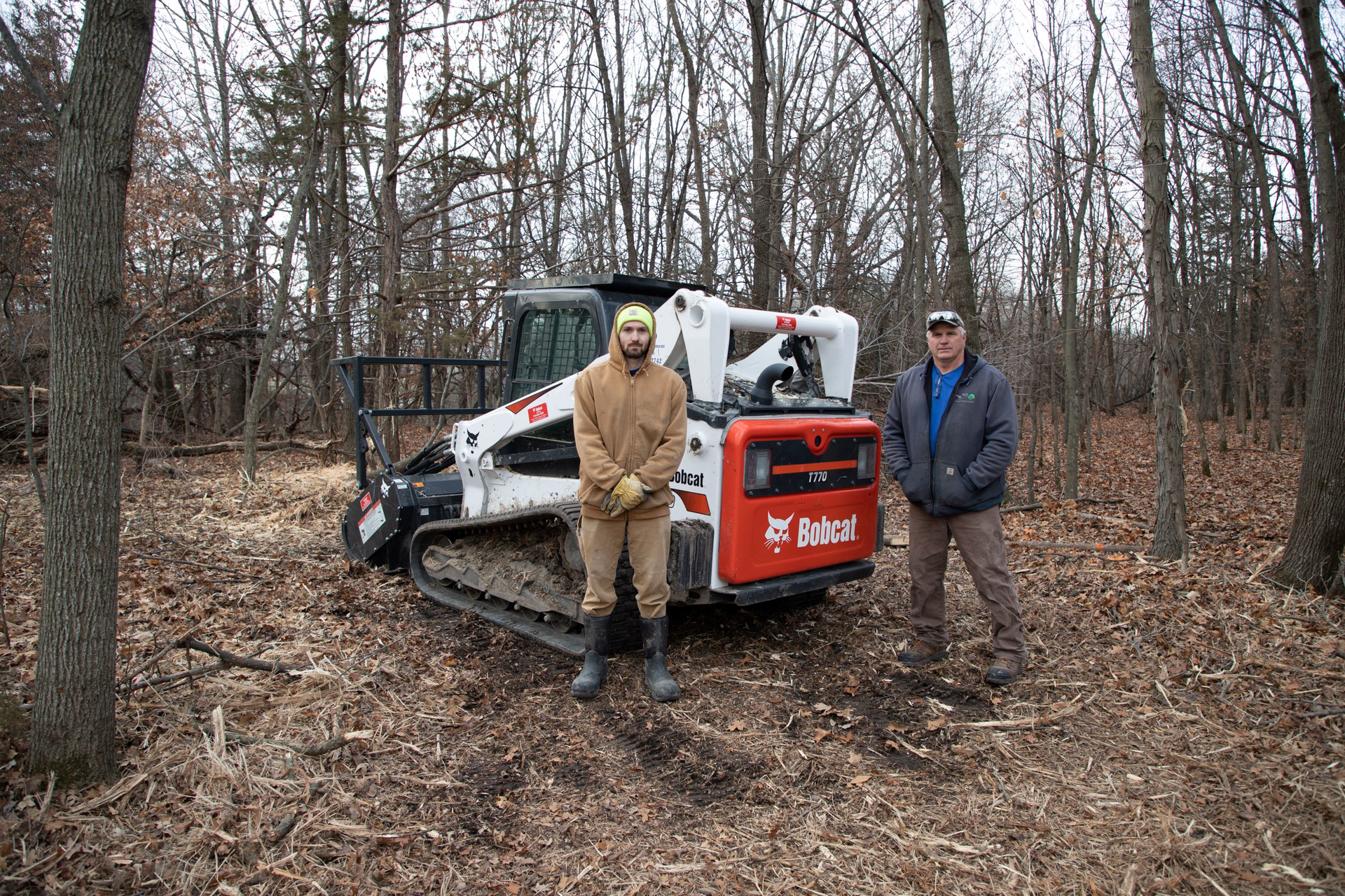Dan Hansen (right), co-owner of K&D Land Improvement with wife Karen, has his son Zach Hansen (left) working alongside him on jobs.