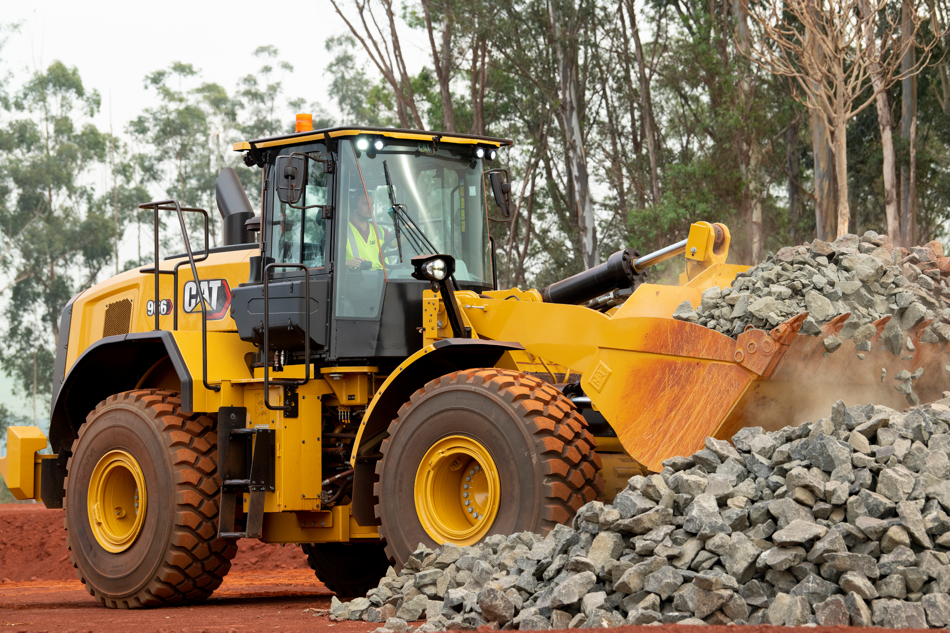 Digging and hauling larger rocks require a stronger bucket on wheel loaders like this Cat 966.
