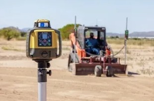 The system may be customized by using either a dual laser receiver setup for elevation at both edges of the blade or a single laser receiver with a dual-axis tilt sensor for elevation and slope determination.