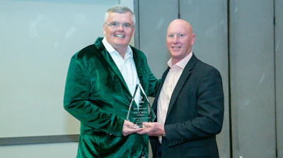 ACPA President Wayne Bylsma (right) presented the Hall of Fame Award to Tom O’Malley, along with a flashy green jacket (pictured) from Tom’s former employer, Schwing America. The jacket was both an inside joke and a sentimental gift that signified his 24-year tenure with Schwing.