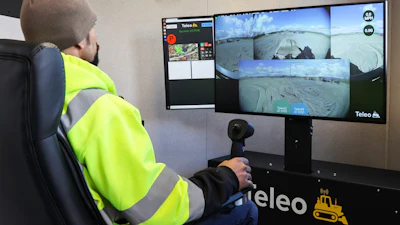 An operator controlling two John Deere 333G Compact Track Loaders in Northern California, switching between remote operation and autonomy.