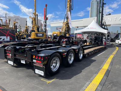The custom trailer maintains a 70-ton rating at half the deck length and offers 6-in. loaded road clearance.
