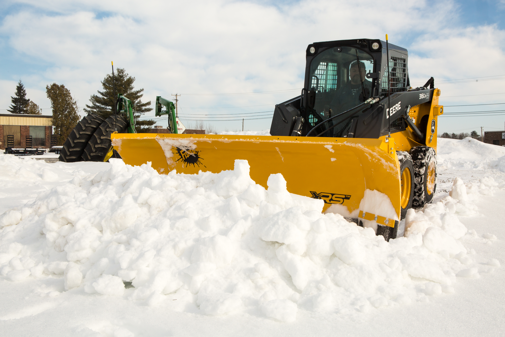 Designed specifically for skid steer applications, this rugged plow automatically retracts the inside wing when fully angled and then automatically returns to the scoop position once straight.