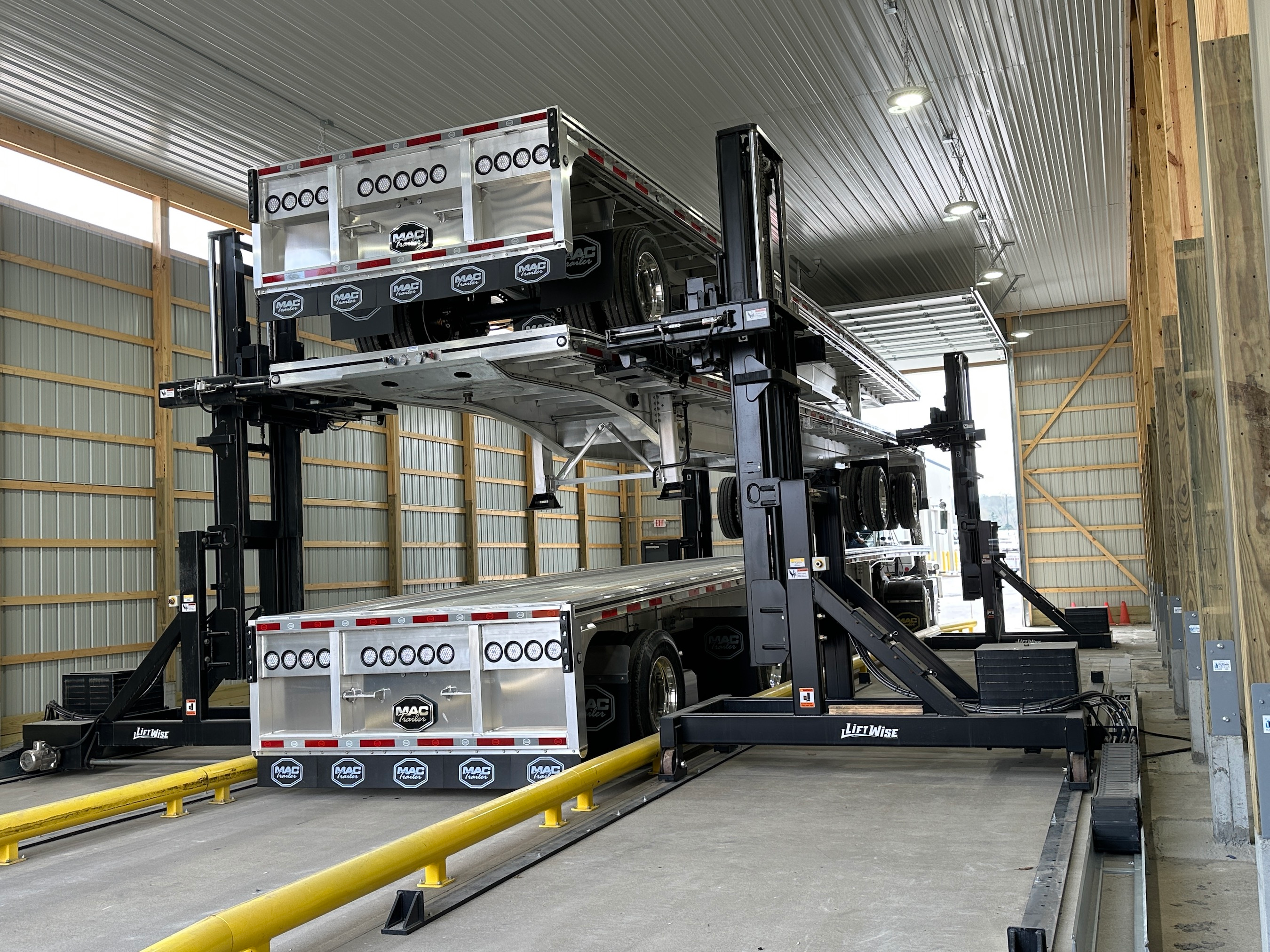 The stacking system requires just one person to operate without the need for special rigging, slings or climbing onto the trailers.