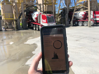 A worker is watching the BCMI Material Now app at the concrete plant.