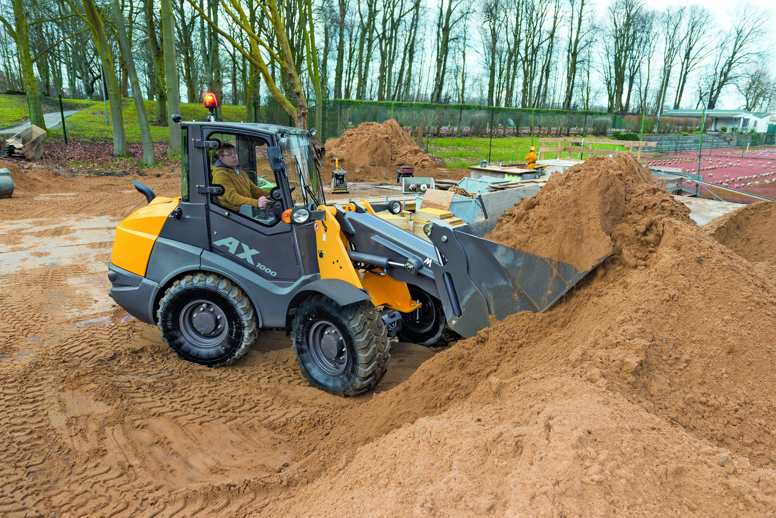 The AX1000 Articulated Loader has a standard bucket volume of 1.3 cu. yd. (1 cubic meter) plus a 75-hp engine.