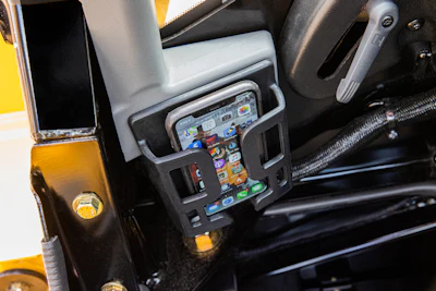 Creature comfort features such as Bluetooth radios and cell phone trays and chargers can make long days in compact equipment cabs more comfortable and productive.