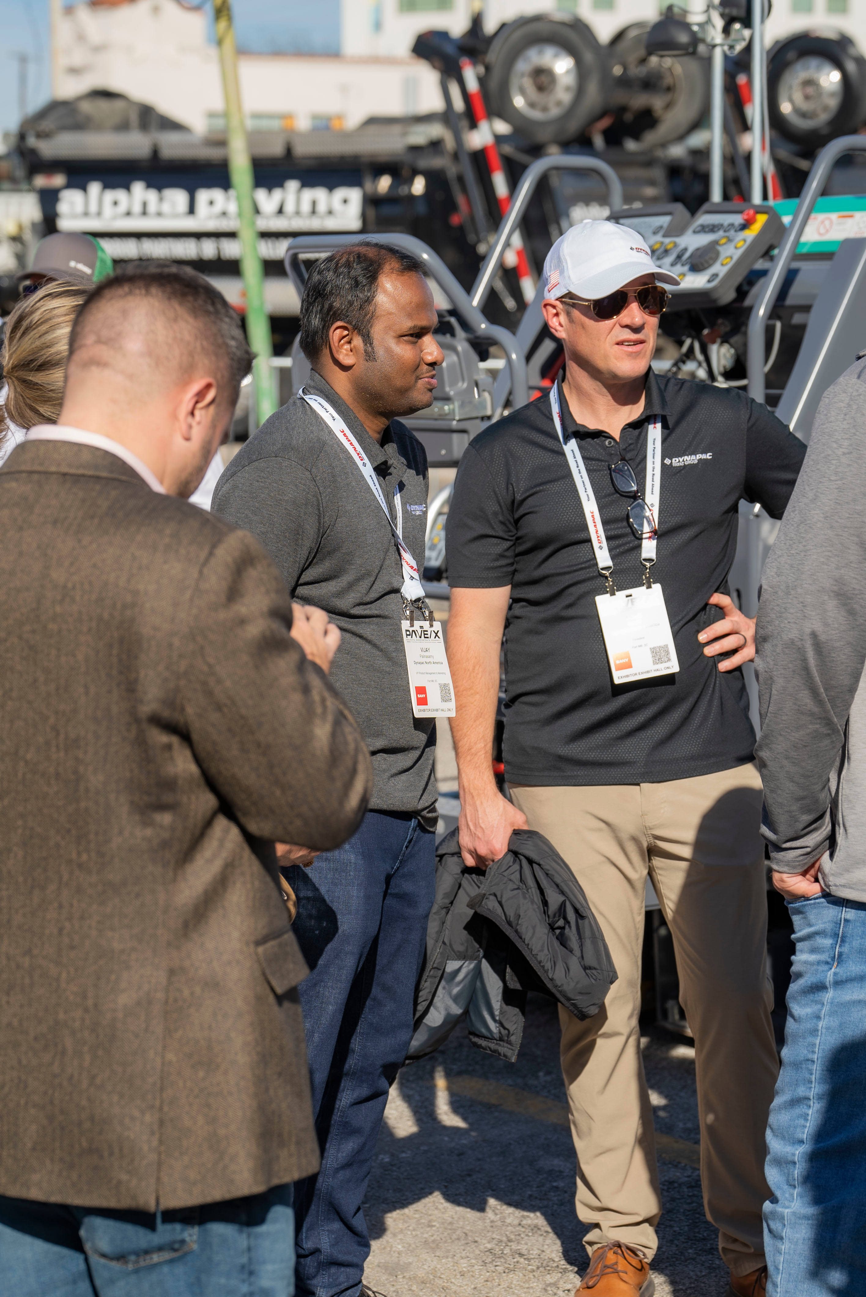 (Left) Vijay (Right) Jamie Roush, President and General Manager of Dynapac talking with attendees in the live demo area at PAVE/X 2024.