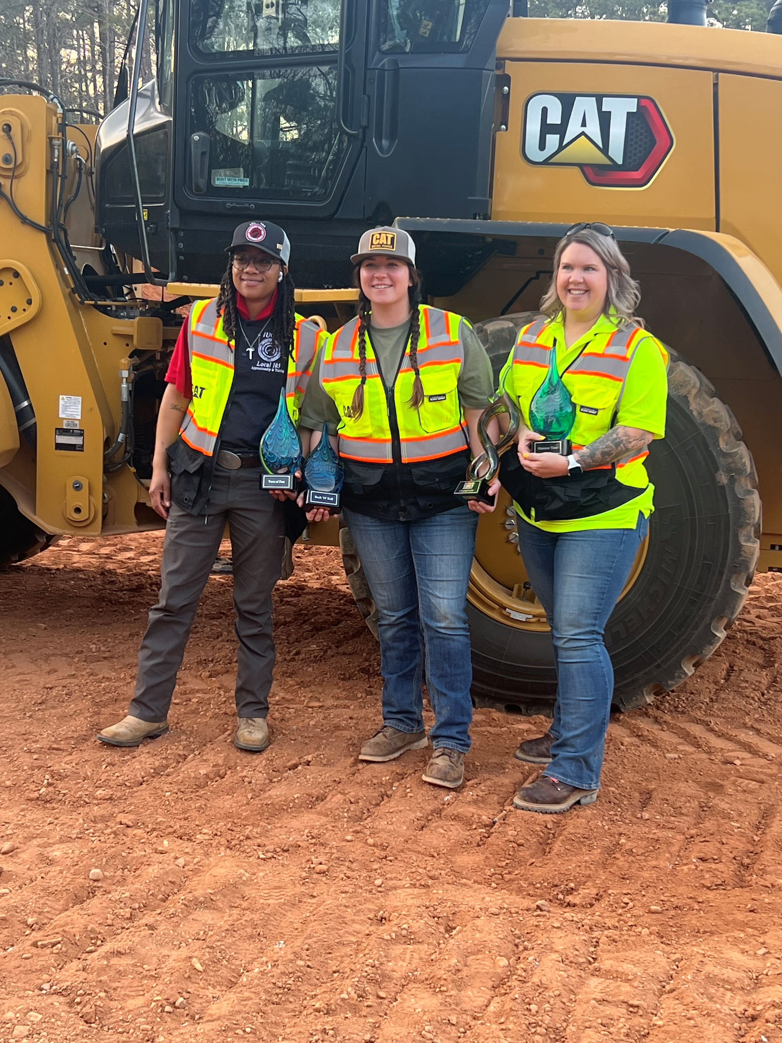 Azaria Biven of Indiana, Kait Burds of Iowa and Kenzi Tackett of Ohio received awards at the first Caterpillar Women in Construction Celebration, which included operator skills competitions.