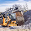 The Hyundai HT100V CTL working in a gravel-hauling application.