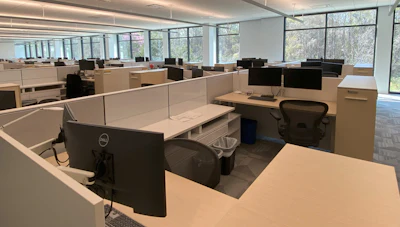 The open work areas have windows that allow personnel to feel embedded in nature.