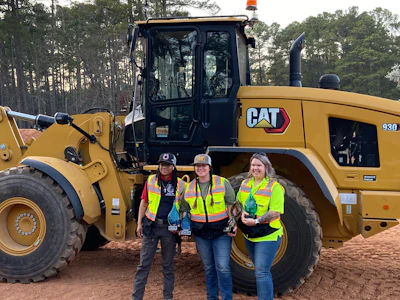 Tackette with the skills test winners; (left to right) small hydraulic excavator winner Azaria Biven, overall winner and wheel loader winner Kait Burds, and compact track loader winner Tackette