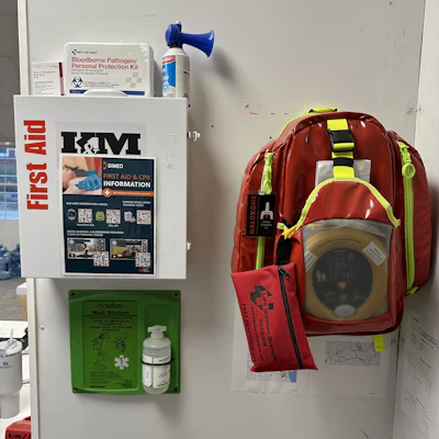 A mounted medical response backpack and first aid kit.