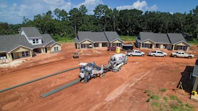 Wirtgen's AutoPilot 2.0 system consists of a base station, a tablet computer and the control unit integrated in the paver.