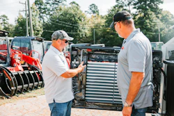 Takeuchi’s Moore employees signed the interior engine cover of the 10,000th CTL, making it a once-in-a-lifetime purchase.