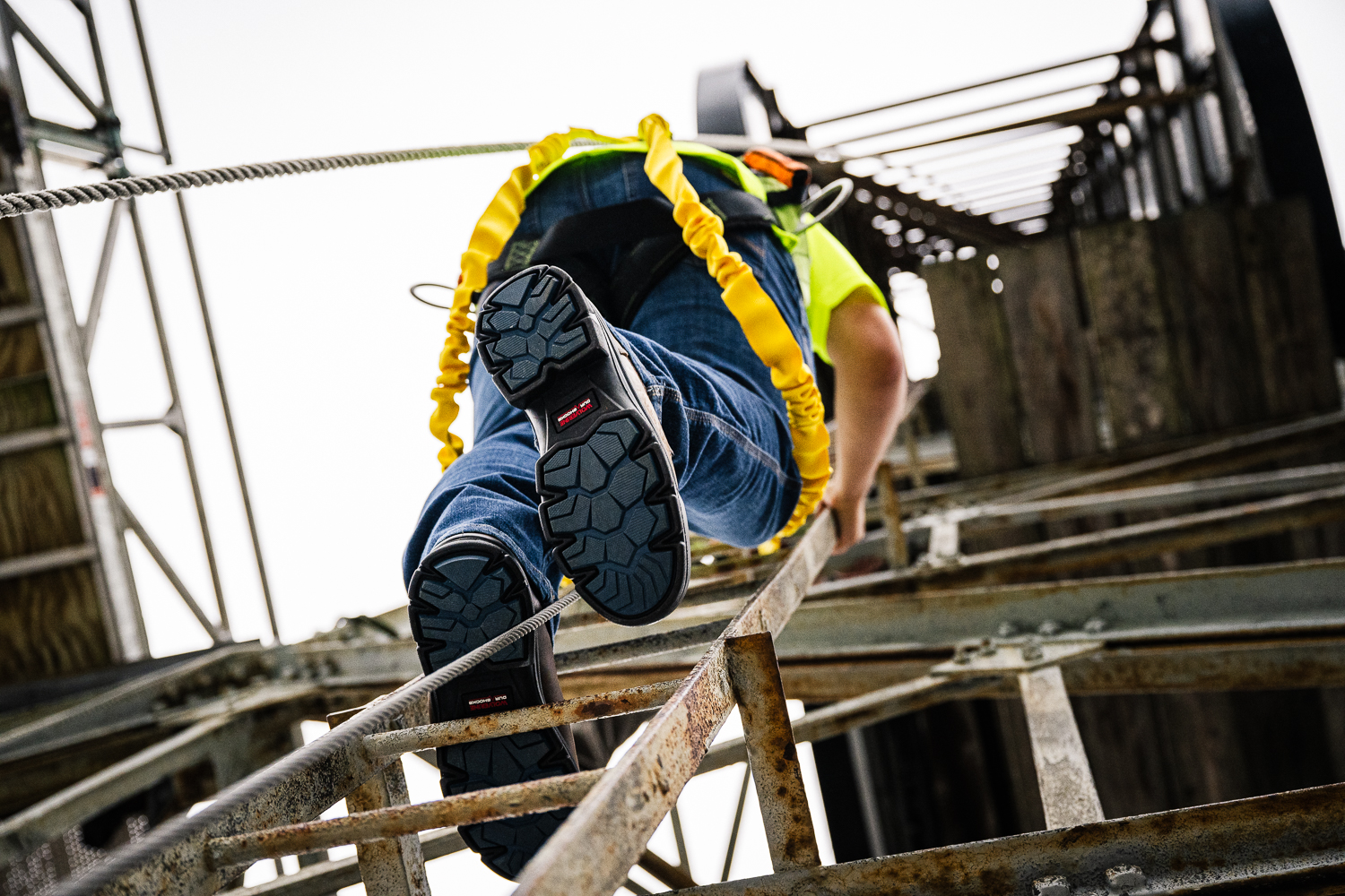 A construction worker’s feet are at risk of injury from things like falling objects, slippery surfaces, uneven surfaces, or sharp objects lying around.