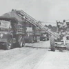 One advantage of a motor grader/EGA outfit was that it required only one operator. But in some loading situations, a spotter rode out on the parent’s frame to direct hauler traffic, somewhat negating the labor savings. Courtesy: Ulrich Manufacturing Company Form 1231, n. d., HCEA Archives