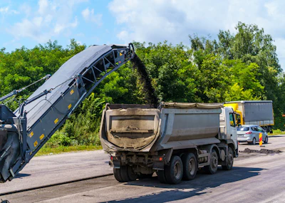 In addition to problems with the dump and the bed, build-up that remains in the truck bed will cool and cure. If portions break off during the following haul, this partially cooled and set mix is not consistent with the new load. An inconsistent mix could lead to sections of pavement with varying properties.