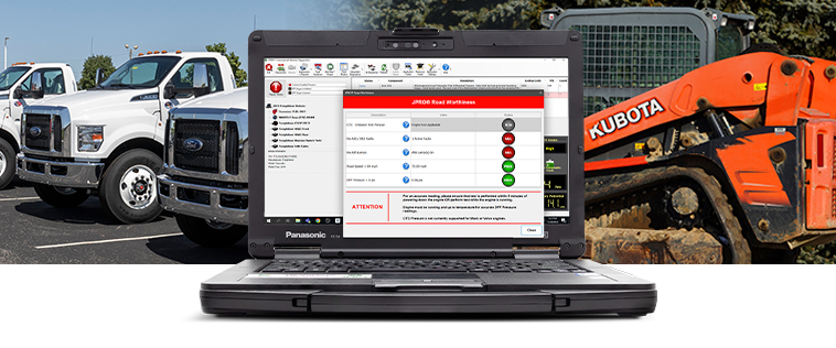 Diagnostic software laptop with commercial truck and Kubota machinery