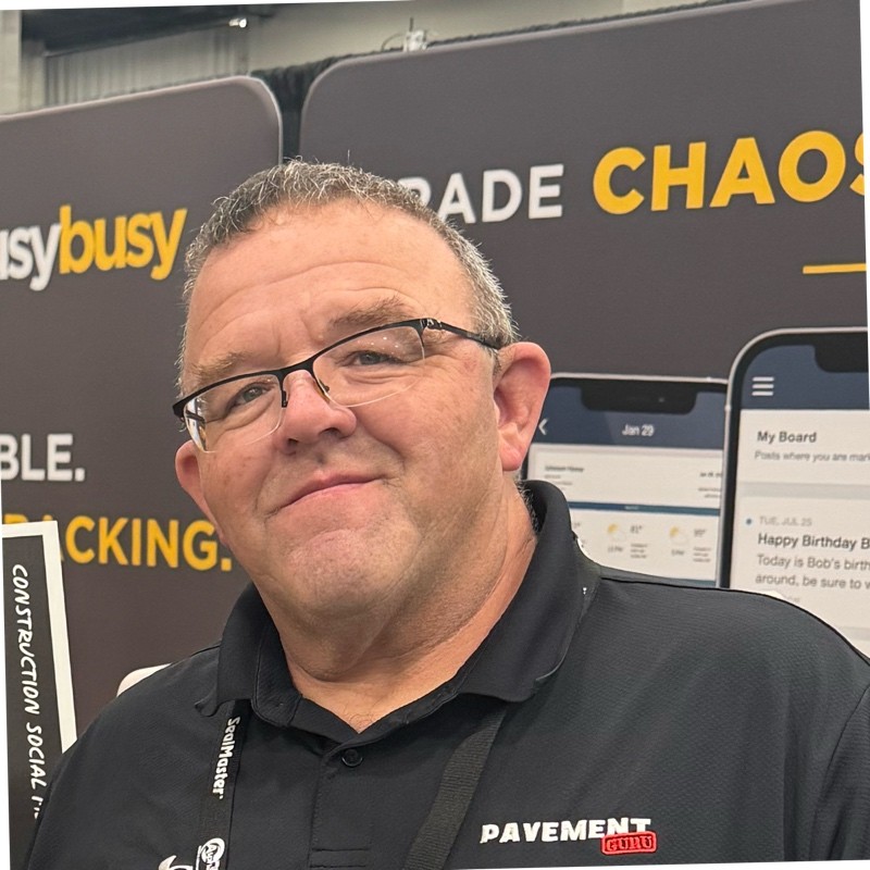 Professional at Pavement trade show booth with digital display Headshot